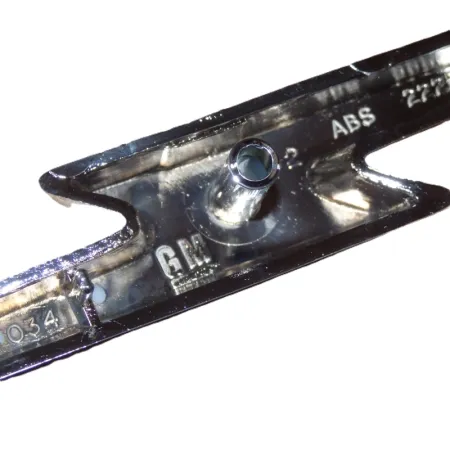 Emblemat atrapy przedniej Opel Astra F